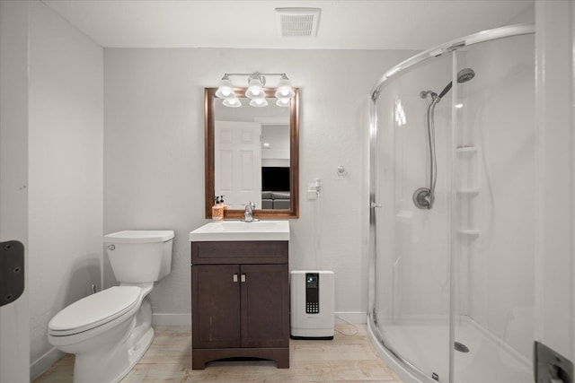 5916 S Division St, Spokane, WA 99224 - bathroom with a shower stall, vanity, and wood finished floors