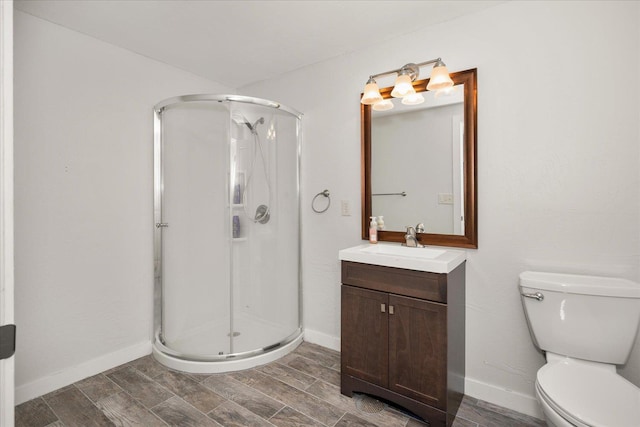 5916 S Division St, Spokane, WA 99224 - bathroom with a stall shower, vanity, and wood finish floors