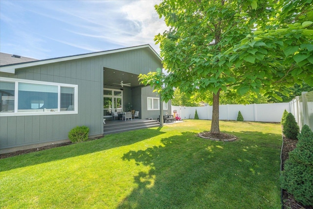 5916 S Division St, Spokane, WA 99224 - fenced backyard with a ceiling fan and a deck