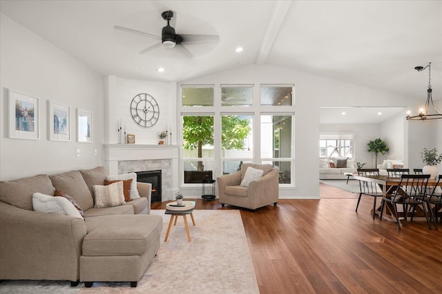 5916 S Division St, Spokane, WA 99224 - living room with wood finished floors, a tiled fireplace, ceiling fan, recessed lighting, and a chandelier
