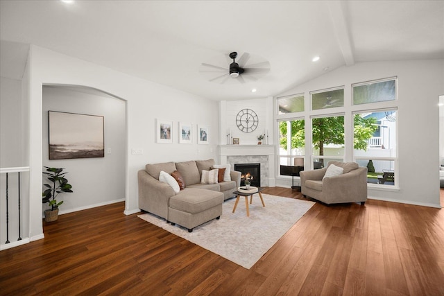 5916 S Division St, Spokane, WA 99224 - living room with dark wood-style flooring, a ceiling fan, and a warm lit fireplace