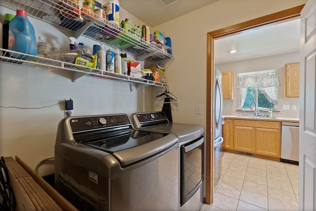17813 N Lidgerwood St, Colbert, WA 99005 - laundry area featuring washer and dryer, light tile patterned floors, and recessed lighting