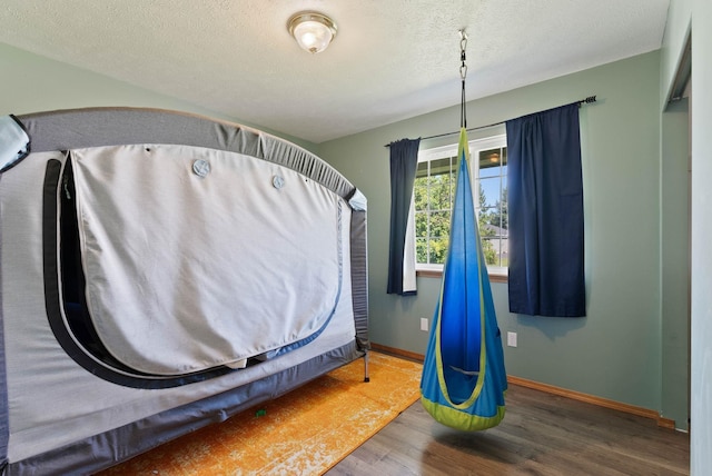 17813 N Lidgerwood St, Colbert, WA 99005 - misc room with wood finished floors and a textured ceiling
