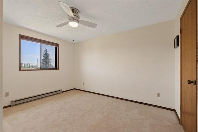 417 Clay St Unit A, Cheney, WA 99004 - empty room with a baseboard radiator, light colored carpet, and ceiling fan