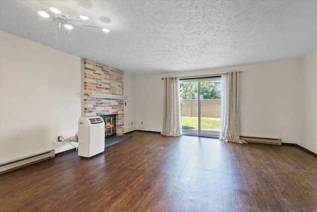 417 Clay St Unit A, Cheney, WA 99004 - unfurnished living room with wood finished floors, a textured ceiling, baseboard heating, and a fireplace