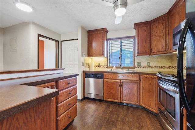 417 Clay St Unit A, Cheney, WA 99004 - kitchen with stainless steel appliances, dark wood finished floors, backsplash, a textured ceiling, and ceiling fan
