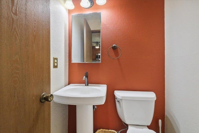 417 Clay St Unit A, Cheney, WA 99004 - bathroom featuring toilet and a textured wall