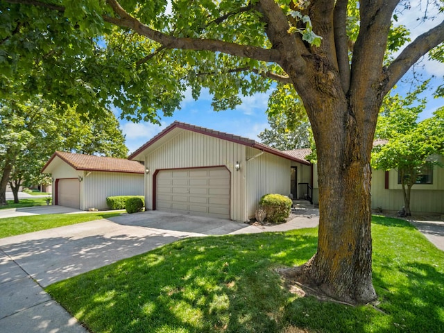 3808 S Alder Dr, Spokane, WA 99223 - ranch-style home with a tiled roof, a front lawn, driveway, and a garage