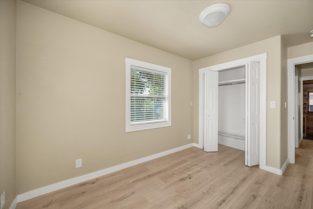 2323 E Rich Ave, Spokane, WA 99207 - unfurnished bedroom with light wood finished floors and a closet