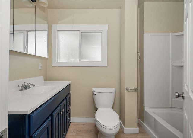 2323 E Rich Ave, Spokane, WA 99207 - bathroom featuring vanity, washtub / shower combination, and wood finished floors