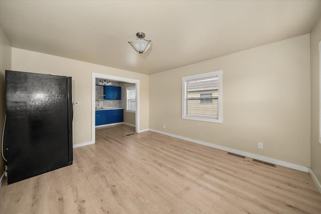 2323 E Rich Ave, Spokane, WA 99207 - empty room featuring light wood finished floors and baseboards