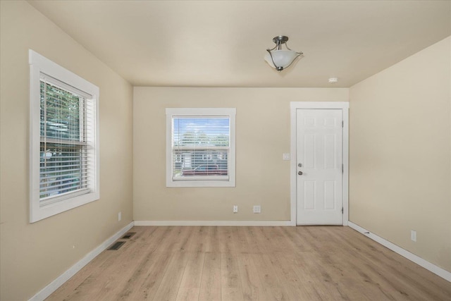 2323 E Rich Ave, Spokane, WA 99207 - spare room featuring healthy amount of natural light and wood finished floors