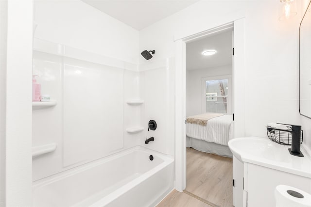 1227 E Providence Ave, Spokane, WA 99207 - bathroom with tub / shower combination, vanity, ensuite bathroom, and wood finished floors