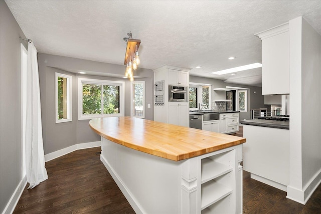 8024 E Elde Dr, Spokane, WA 99212 - kitchen featuring open shelves, stainless steel appliances, white cabinetry, butcher block countertops, and dark wood-style flooring