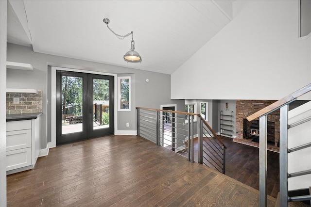 8024 E Elde Dr, Spokane, WA 99212 - foyer entrance with french doors, hardwood / wood-style floors, a brick fireplace, and high vaulted ceiling