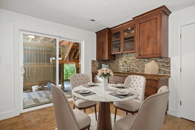 8024 E Elde Dr, Spokane, WA 99212 - dining area with baseboards and brick patterned flooring