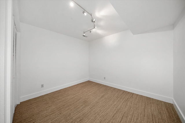 8024 E Elde Dr, Spokane, WA 99212 - carpeted empty room with baseboards and rail lighting