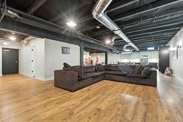 315 W Riverside Ave Unit 101, Spokane, WA 99201 - living area featuring hardwood / wood-style floors and baseboards