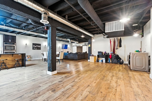 315 W Riverside Ave Unit 101, Spokane, WA 99201 - finished below grade area featuring wood finished floors and baseboards