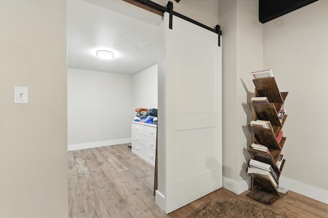 315 W Riverside Ave Unit 101, Spokane, WA 99201 - hall with a barn door and wood finished floors
