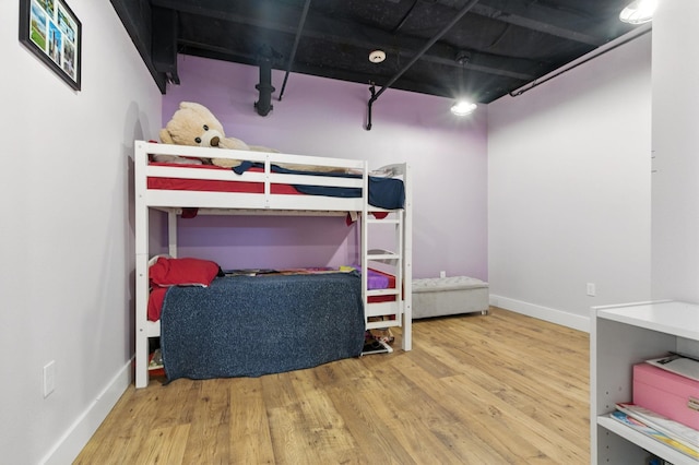 315 W Riverside Ave Unit 101, Spokane, WA 99201 - bedroom with wood finished floors and baseboards