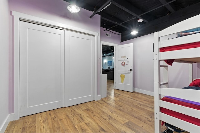 315 W Riverside Ave Unit 101, Spokane, WA 99201 - bedroom with wood finished floors and a closet