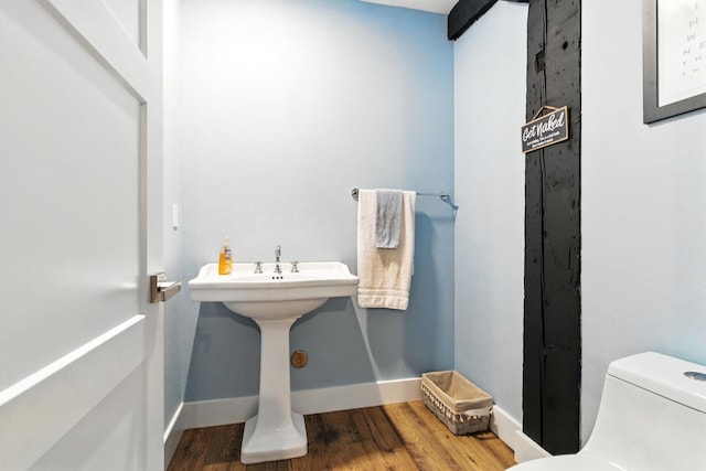 315 W Riverside Ave Unit 101, Spokane, WA 99201 - half bathroom with wood finished floors and toilet