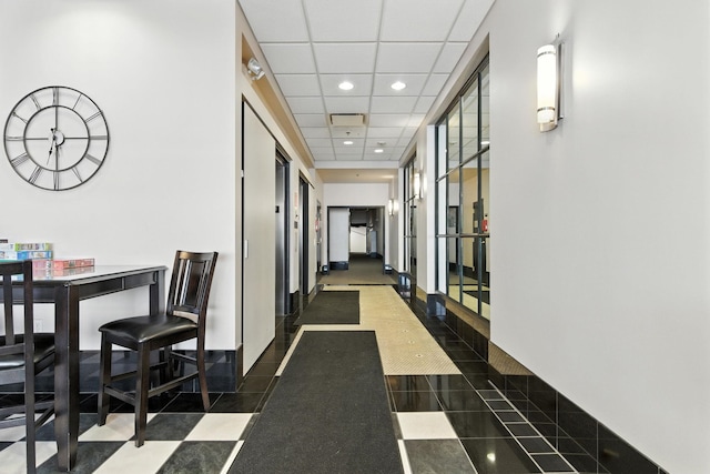 315 W Riverside Ave Unit 101, Spokane, WA 99201 - hallway featuring recessed lighting, a drop ceiling, and dark tile patterned flooring
