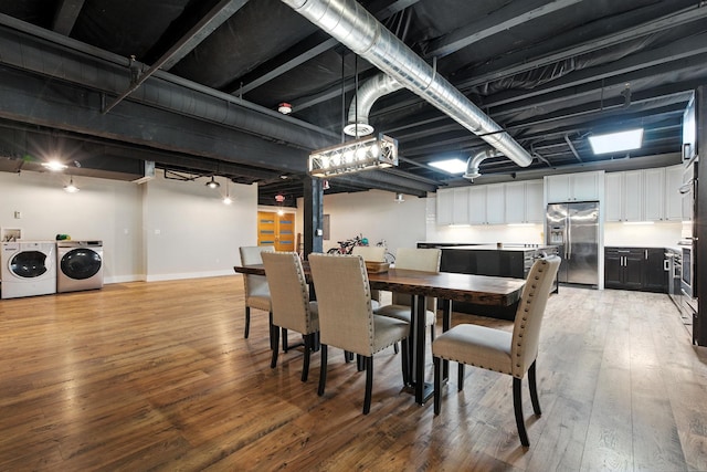 315 W Riverside Ave Unit 101, Spokane, WA 99201 - dining space featuring washing machine and clothes dryer and light wood-type flooring