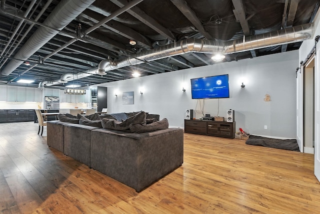 315 W Riverside Ave Unit 101, Spokane, WA 99201 - living room featuring light wood-style flooring and a barn door