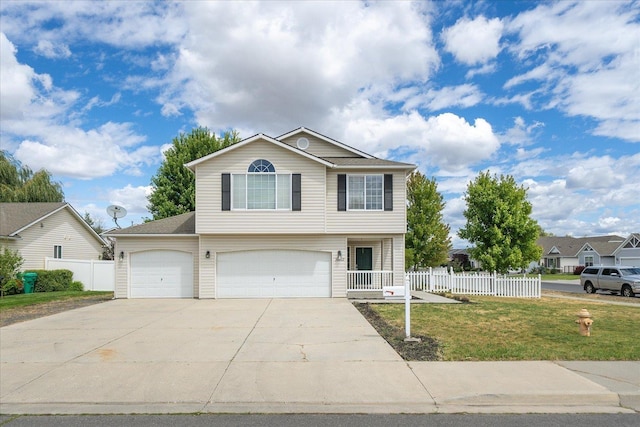10002 W Richland Rd, Cheney, WA 99004 - view of front of house with a garage and driveway