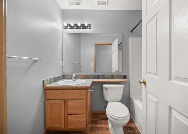 10002 W Richland Rd, Cheney, WA 99004 - full bath featuring vanity, wood finished floors, and washtub / shower combination