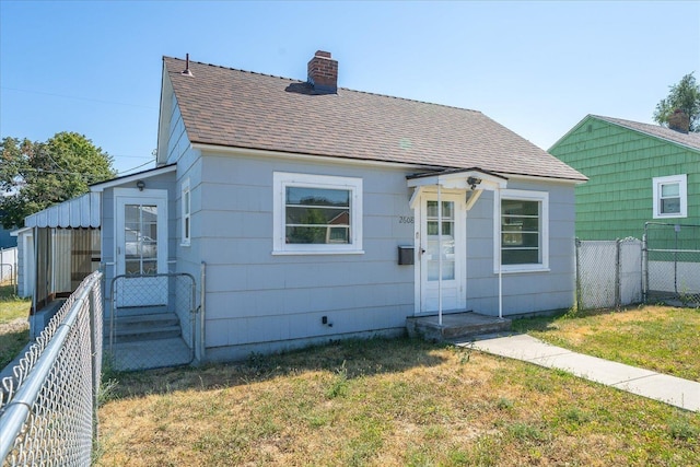 2608 E Heroy Ave, Spokane, WA 99207 - bungalow featuring roof with shingles, a chimney, and entry steps