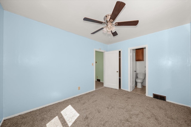 2608 E Heroy Ave, Spokane, WA 99207 - unfurnished bedroom with carpet floors, ceiling fan, and ensuite bathroom