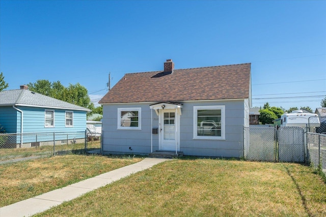 2608 E Heroy Ave, Spokane, WA 99207 - view of front of home featuring roof with shingles, a chimney, and a gate