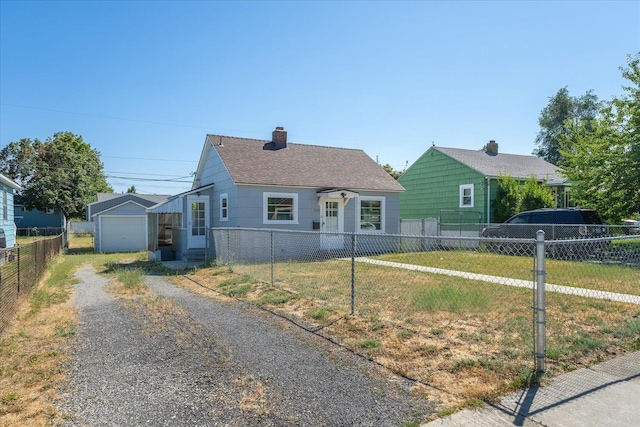 2608 E Heroy Ave, Spokane, WA 99207 - bungalow-style house featuring driveway, a chimney, and a shingled roof