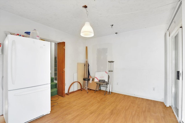 452 W 26th Ave, Spokane, WA 99203 - kitchen with freestanding refrigerator and light wood-type flooring