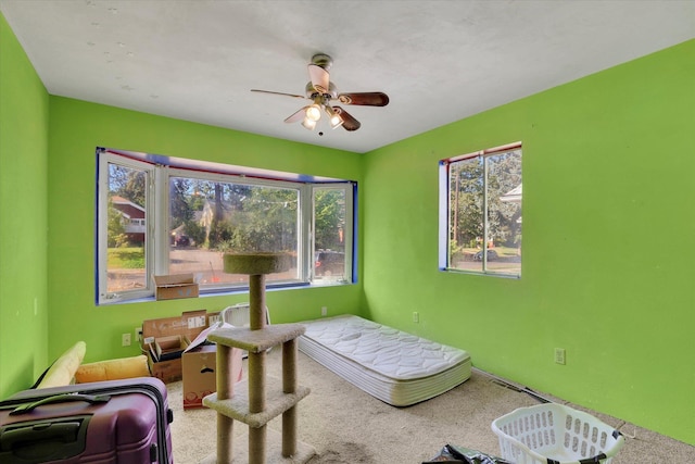 452 W 26th Ave, Spokane, WA 99203 - carpeted bedroom featuring multiple windows and ceiling fan