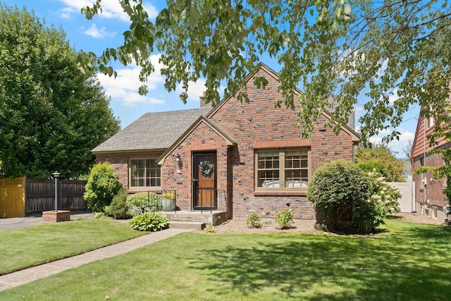 818 W 27th Ave, Spokane, WA 99203 - tudor house with a chimney, brick siding, and stone siding
