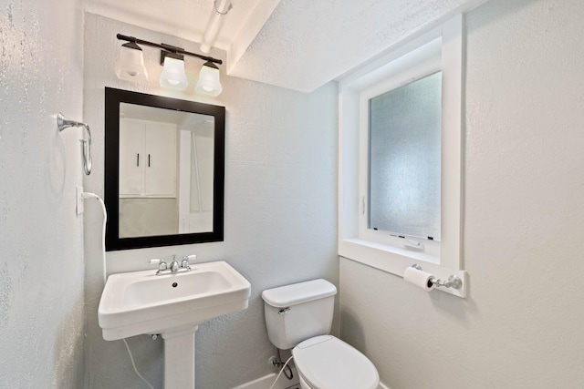 818 W 27th Ave, Spokane, WA 99203 - bathroom featuring toilet and baseboards