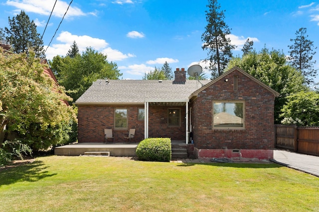 818 W 27th Ave, Spokane, WA 99203 - back of house with brick siding, a chimney, covered porch, and roof with shingles