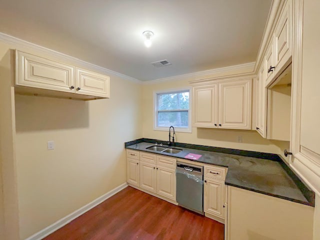 kitchen featuring sink, cream cabinets, dark hardwood / wood-style floors, and dishwasher