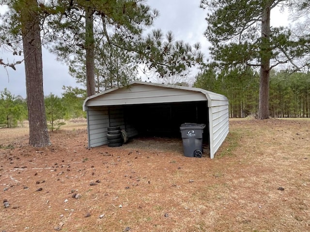 garage featuring a carport