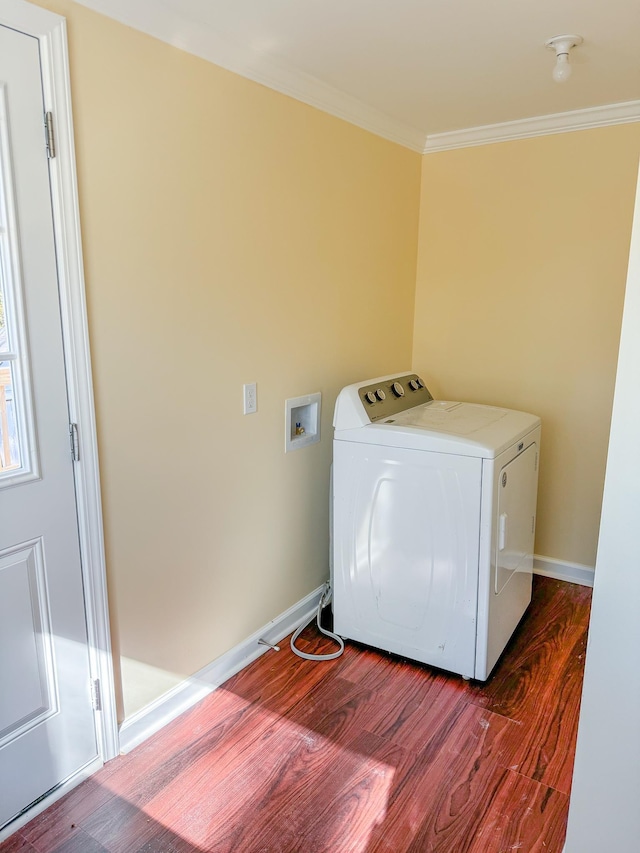 clothes washing area featuring crown molding, washer / clothes dryer, and hardwood / wood-style flooring