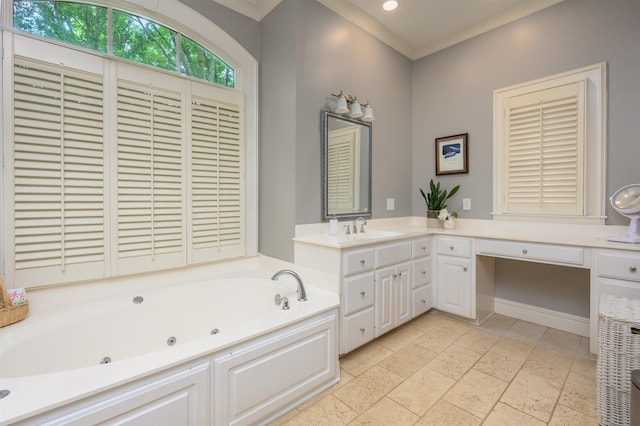 bathroom featuring crown molding, vanity, and a bathing tub