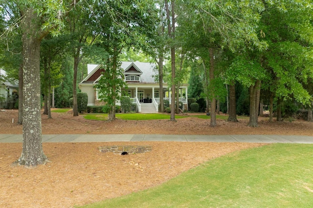 view of home's community with a lawn