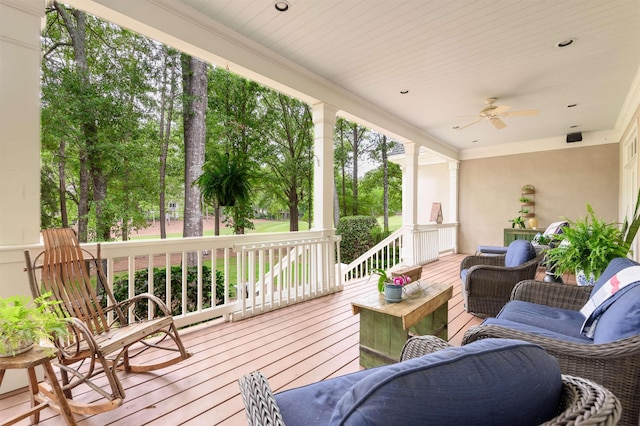 deck with an outdoor hangout area and ceiling fan