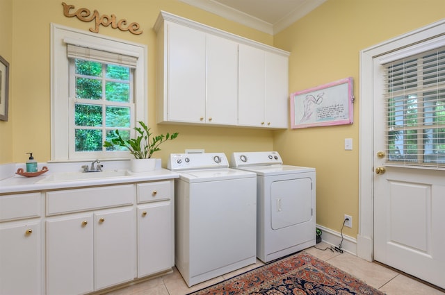 clothes washing area featuring cabinets, sink, independent washer and dryer, and light tile patterned flooring