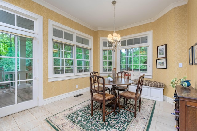 dining room featuring light tile patterned floors, ornamental molding, and a chandelier