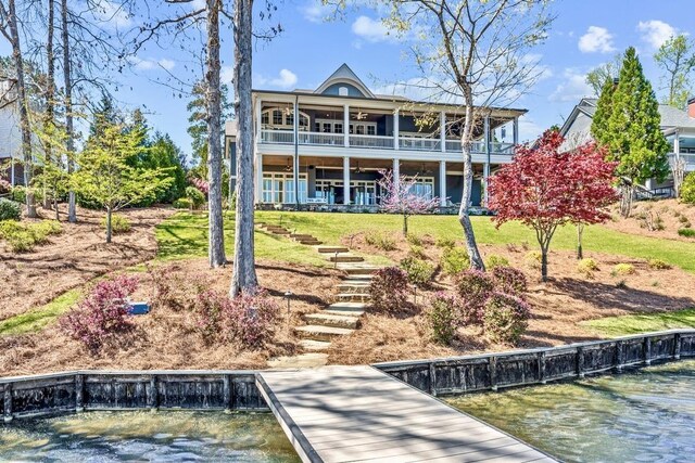 1611 Lighthouse Cir, Greensboro, GA 30642 - rear view of property with a balcony, a water view, and a lawn